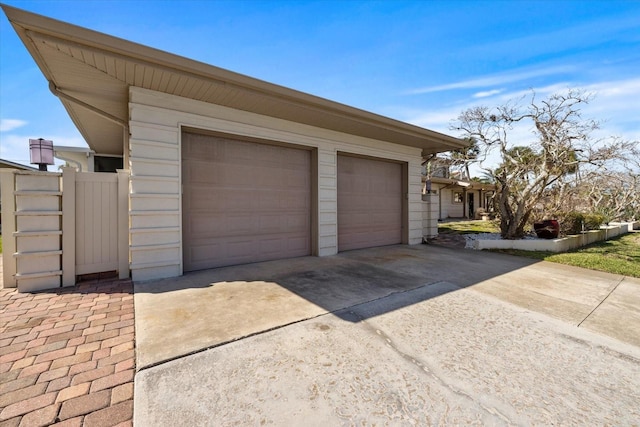 garage featuring driveway