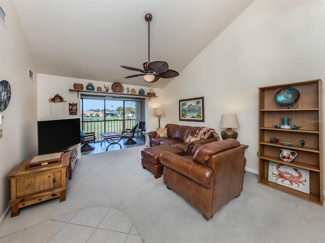 living area featuring ceiling fan, visible vents, and light colored carpet