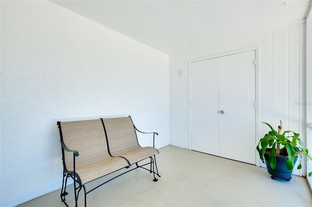 living area with concrete floors