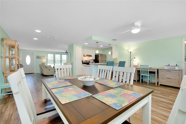 dining space with light wood finished floors, visible vents, recessed lighting, and ceiling fan