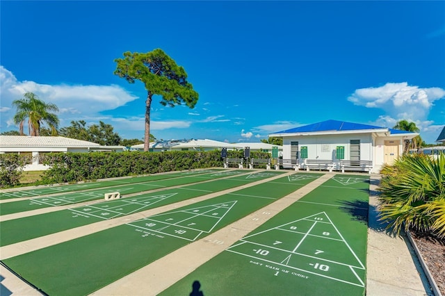 view of property's community featuring shuffleboard