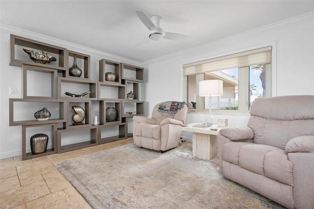 living area with ornamental molding, stone tile flooring, baseboards, and a ceiling fan