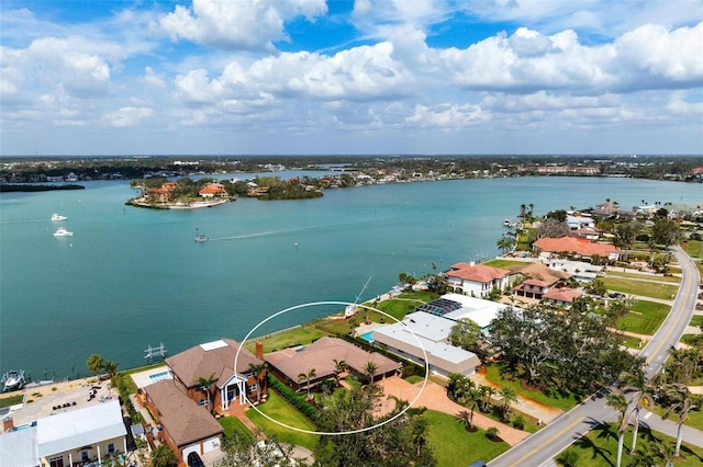 drone / aerial view featuring a water view and a residential view