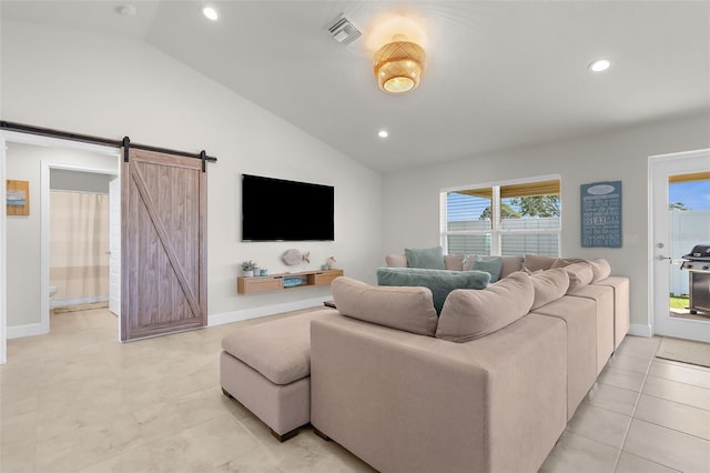 living area with a barn door, recessed lighting, visible vents, baseboards, and vaulted ceiling