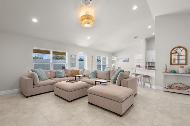 living area featuring plenty of natural light, visible vents, and recessed lighting