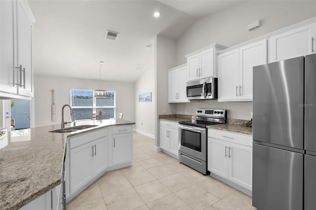 kitchen with stainless steel appliances, lofted ceiling, visible vents, white cabinets, and a sink