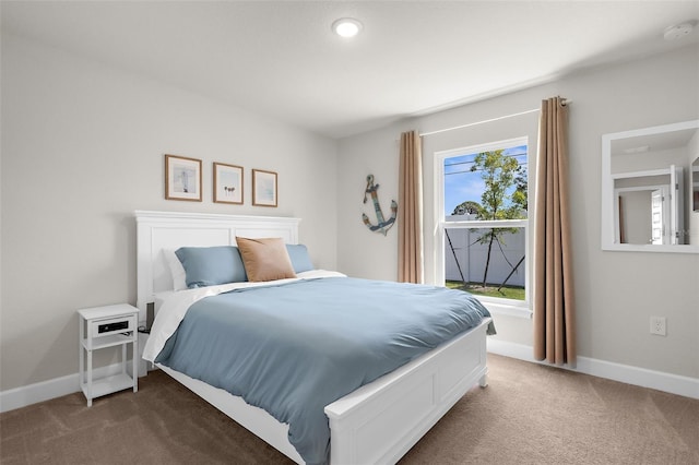 bedroom featuring carpet flooring and baseboards