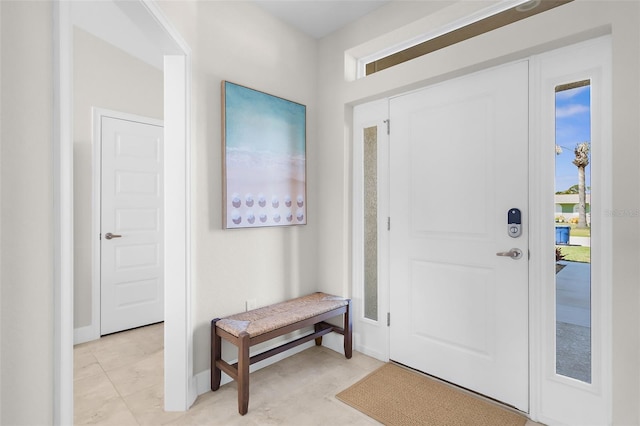 foyer featuring baseboards