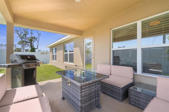 view of patio featuring outdoor dining space, fence, an outdoor living space, and area for grilling