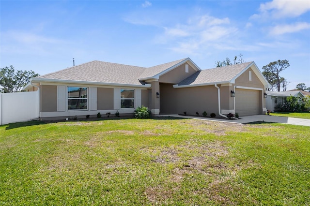 view of front of home with a garage, a front yard, fence, and stucco siding