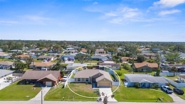 birds eye view of property with a residential view