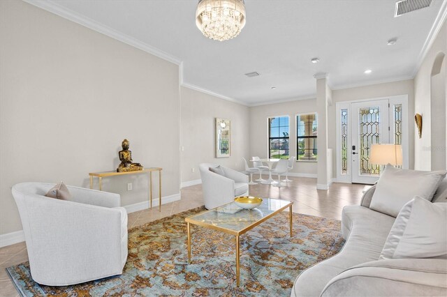 tiled living room featuring baseboards, visible vents, a chandelier, and crown molding