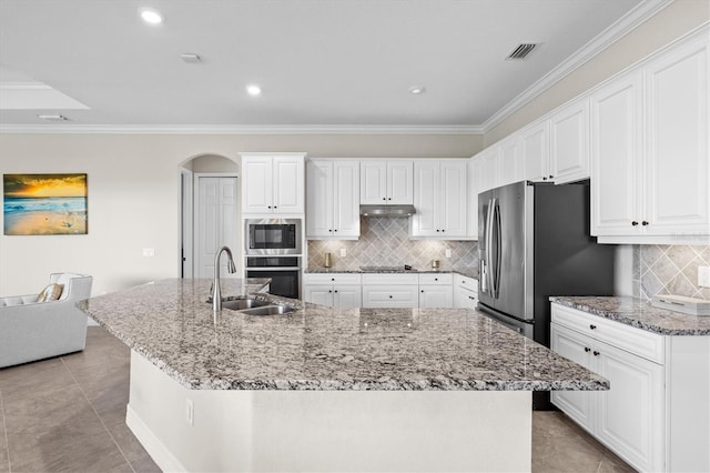 kitchen featuring stainless steel appliances, a large island, a sink, and white cabinets