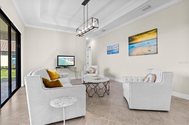 tiled living area with a raised ceiling, visible vents, ornamental molding, a chandelier, and baseboards