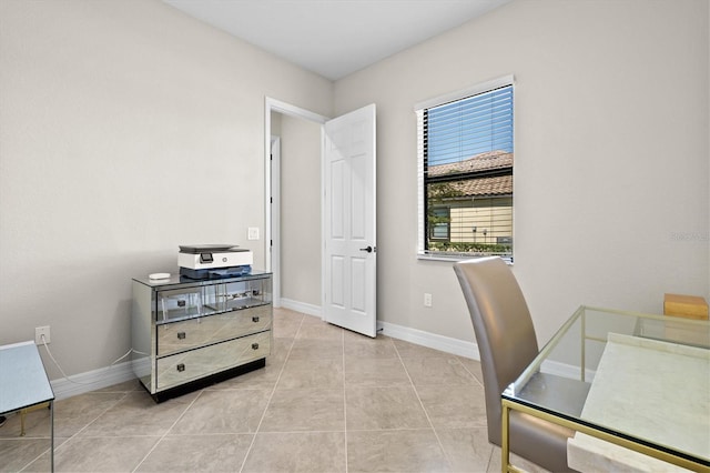 home office featuring light tile patterned floors and baseboards