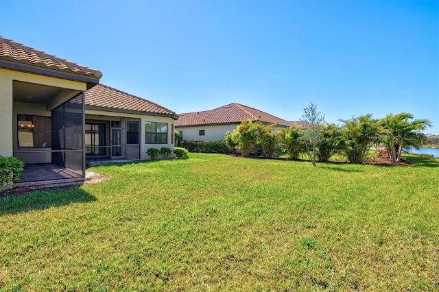 view of yard featuring a sunroom