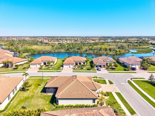 aerial view with a water view and a residential view