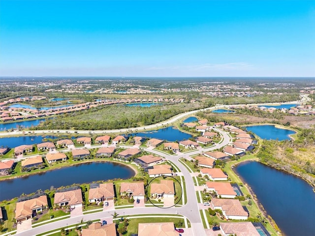 birds eye view of property with a water view and a residential view