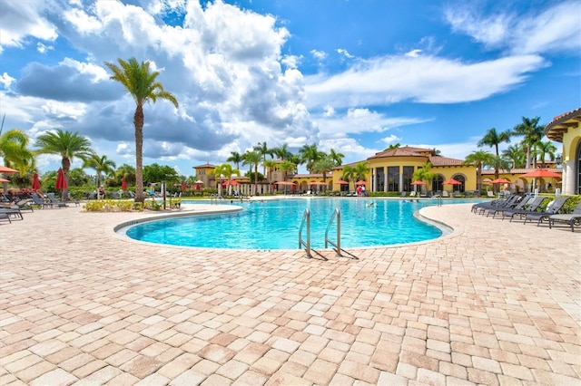 community pool with a patio area