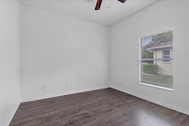 unfurnished room featuring baseboards, wood finished floors, and a ceiling fan