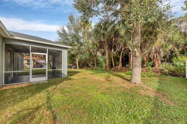 view of yard with a sunroom