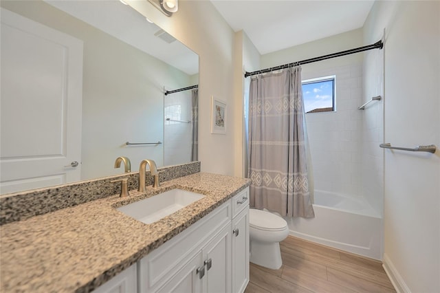 full bath featuring baseboards, toilet, wood finished floors, shower / bath combination with curtain, and vanity