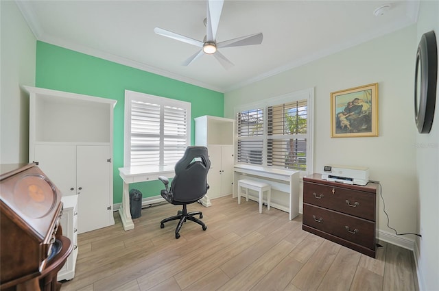 office with light wood finished floors, ornamental molding, and a ceiling fan