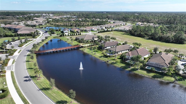 bird's eye view with a water view and a residential view