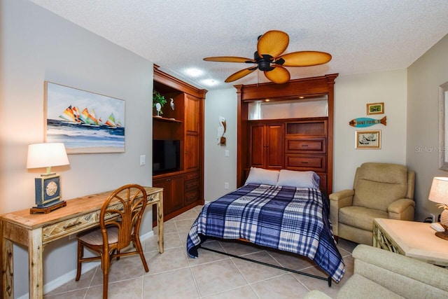 bedroom featuring light tile patterned floors, a textured ceiling, and ceiling fan