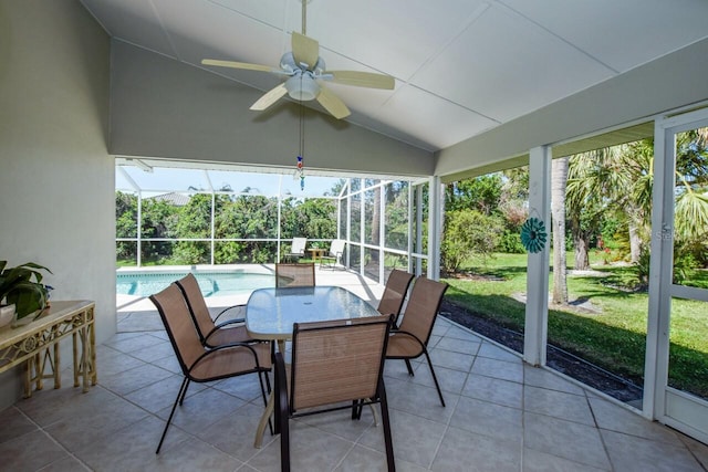 sunroom / solarium featuring lofted ceiling and a ceiling fan