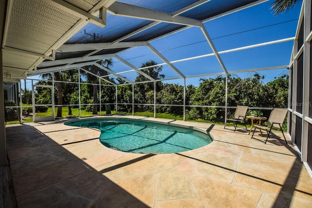 outdoor pool with a patio and a lanai