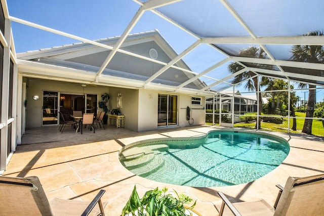 outdoor pool featuring a patio, a lanai, and outdoor dining space