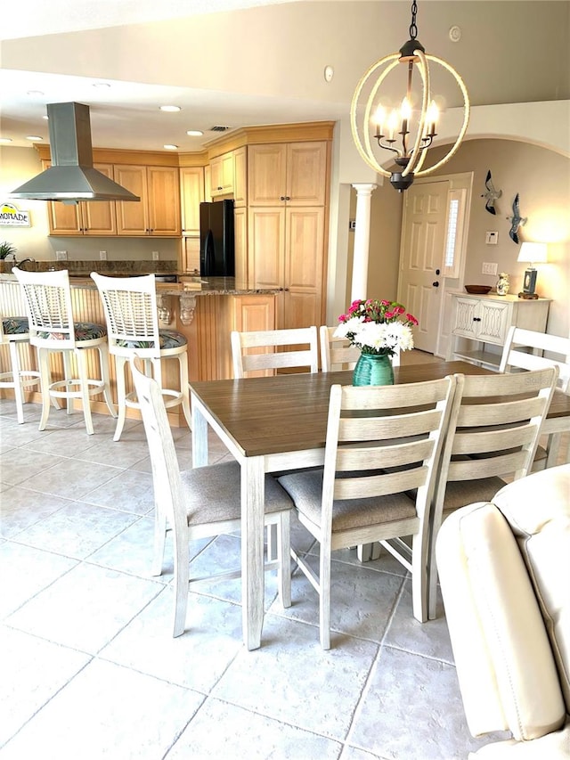 dining space featuring light tile patterned flooring, recessed lighting, and a chandelier