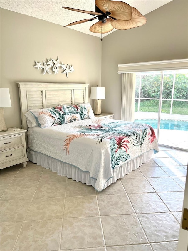 bedroom with access to exterior, light tile patterned floors, a textured ceiling, and ceiling fan