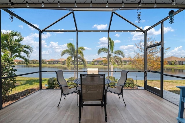 sunroom with a water view