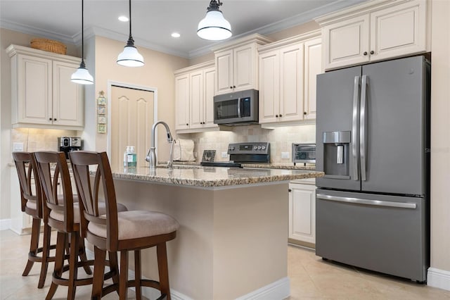 kitchen featuring light tile patterned floors, ornamental molding, light stone counters, stainless steel appliances, and a sink