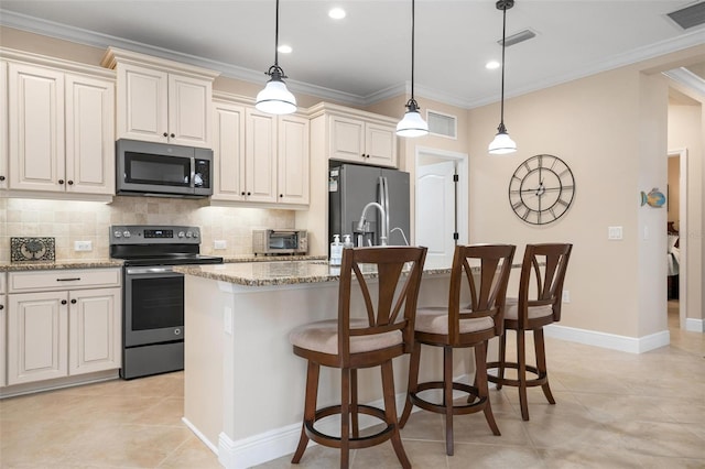 kitchen featuring stainless steel appliances, ornamental molding, backsplash, and visible vents