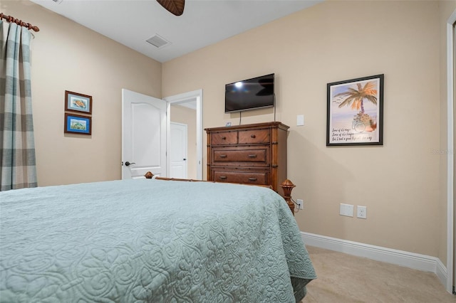 bedroom with baseboards, visible vents, ceiling fan, and light colored carpet