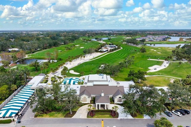 aerial view featuring view of golf course and a water view