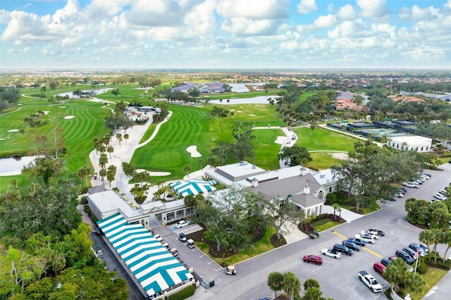 aerial view featuring view of golf course and a water view