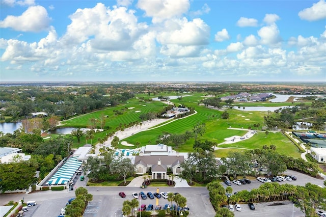 aerial view featuring a water view and golf course view