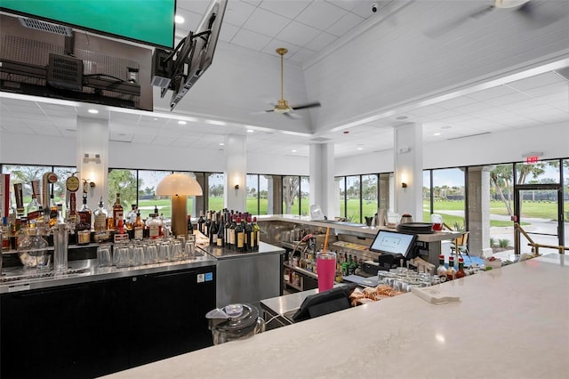 interior space with ceiling fan