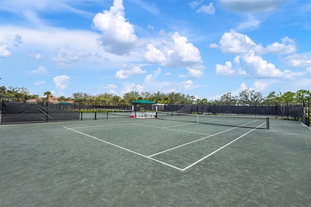 view of sport court with fence