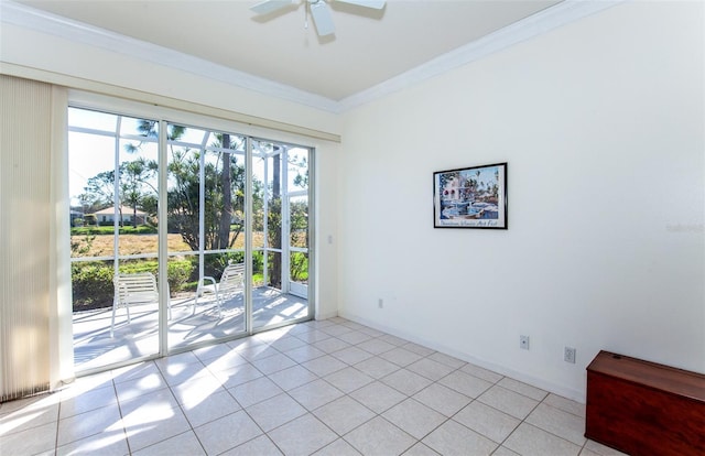 unfurnished room featuring light tile patterned floors, baseboards, a ceiling fan, and crown molding