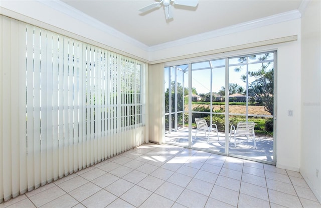 unfurnished sunroom featuring ceiling fan