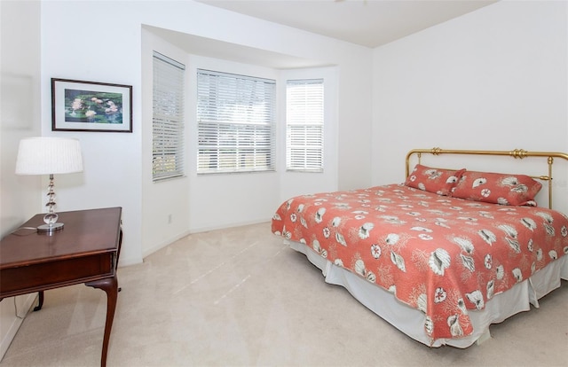 carpeted bedroom with baseboards