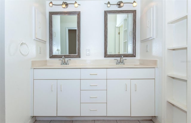 full bathroom featuring a sink and double vanity