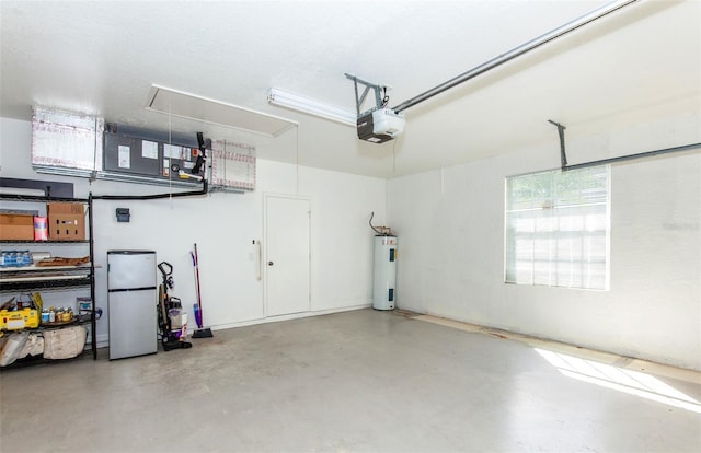 garage featuring a garage door opener, freestanding refrigerator, and water heater