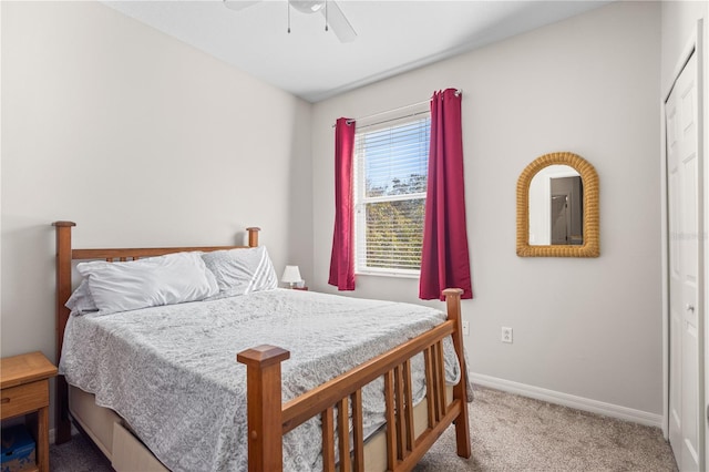 bedroom with ceiling fan, carpet flooring, and baseboards