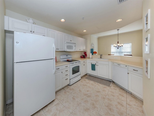 kitchen featuring white appliances, white cabinetry, a sink, and light tile patterned floors